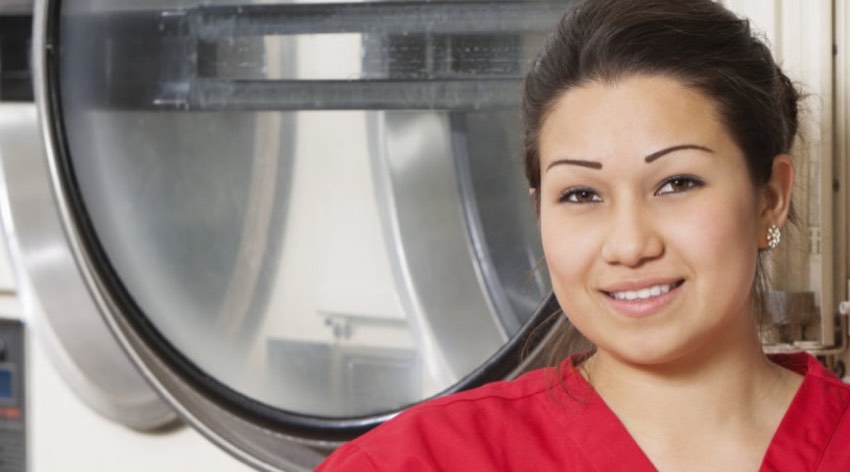 A caregiver at a laundromat
